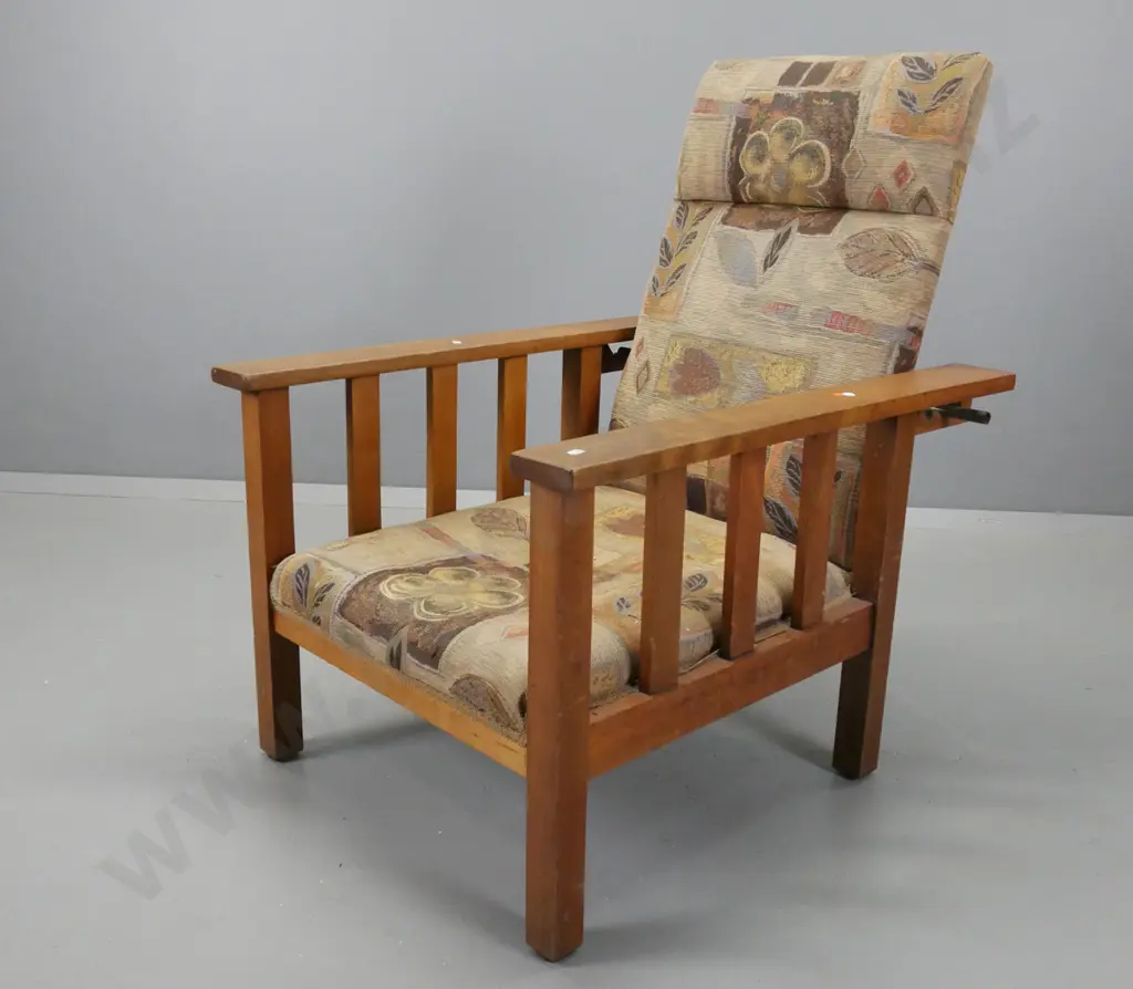 vintage beech Morris chair with slat sides, brass adjustment rod, upholstered in earth tone pattern, sagging slightly in Image 1++