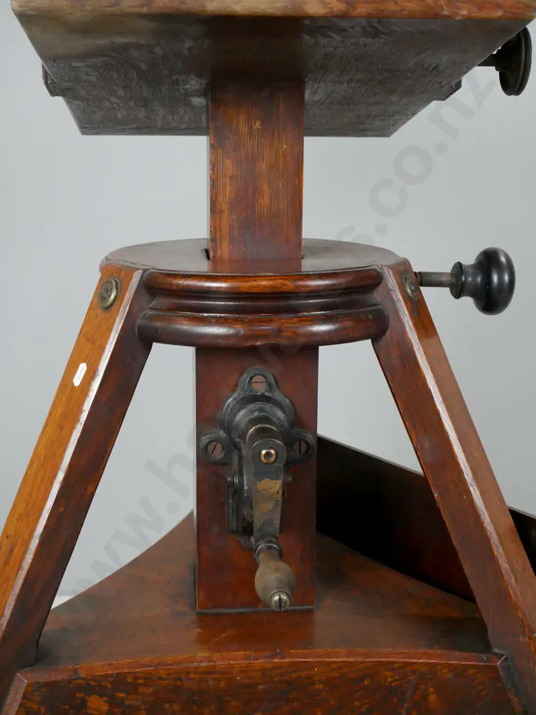 antique oak studio camera platform on tripod base with casters, metal hand crank height adjuster, locking knobs for tilt Image 1++