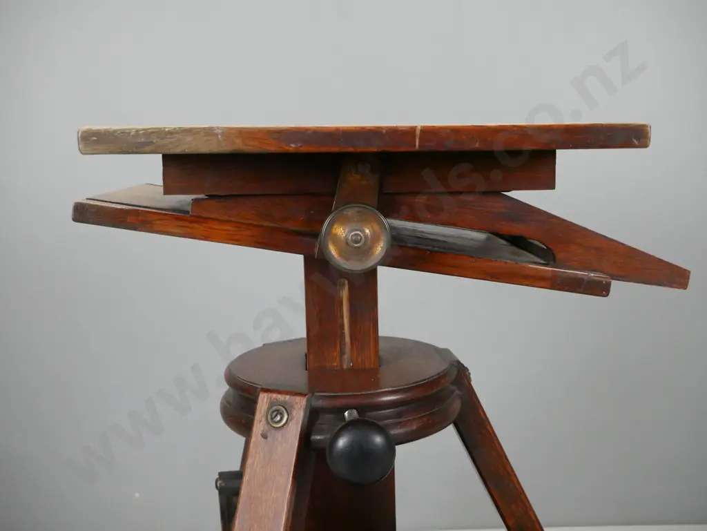 antique oak studio camera platform on tripod base with casters, metal hand crank height adjuster, locking knobs for tilt Image 1++