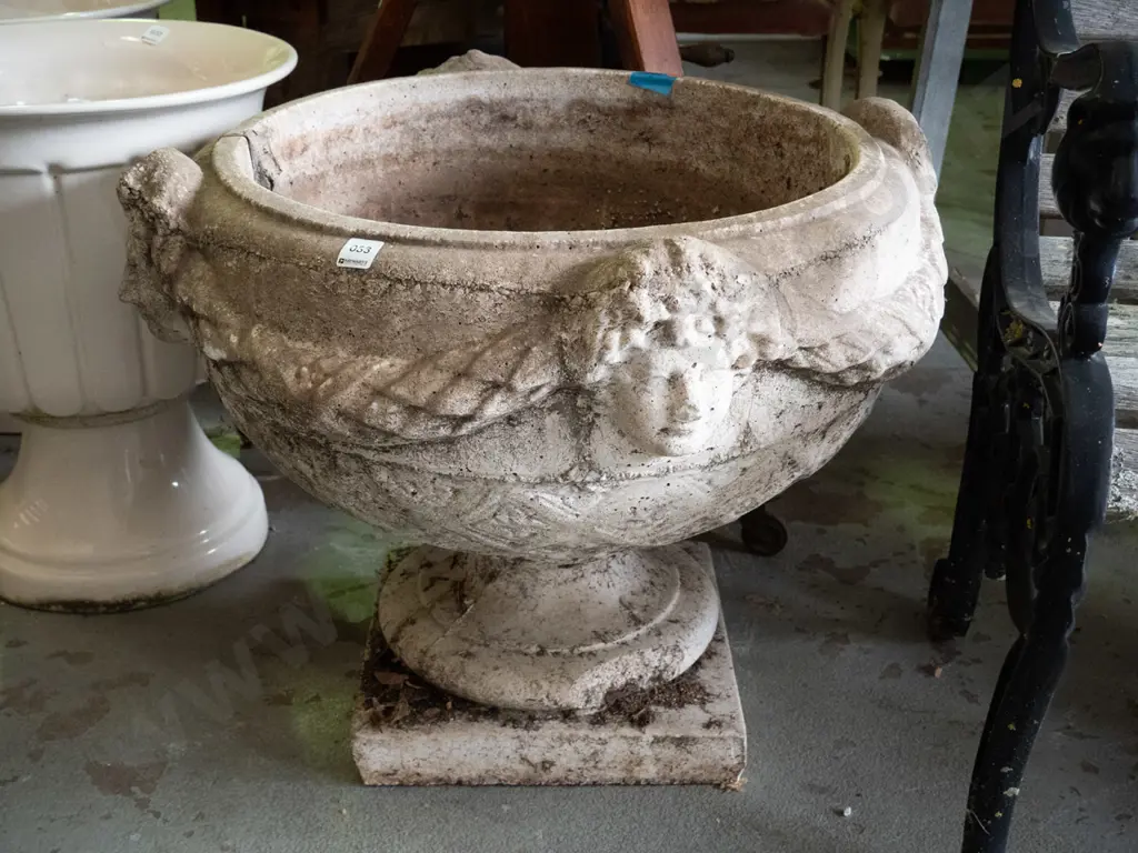large cast concrete classical style garden urn w/ intertwined swags and female heads, pedestal base on square foot Image 1++