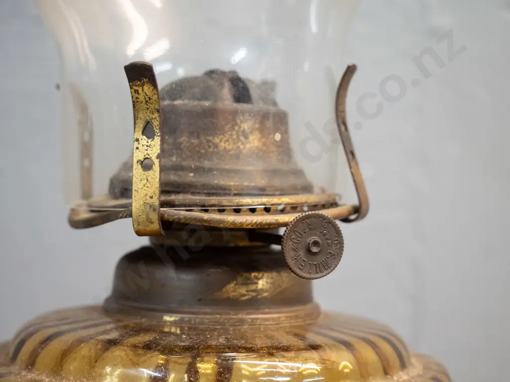 vintage kerosene lamp with cast metal base, amber glass reservoir and clear glass chimney H-500 Image 1++