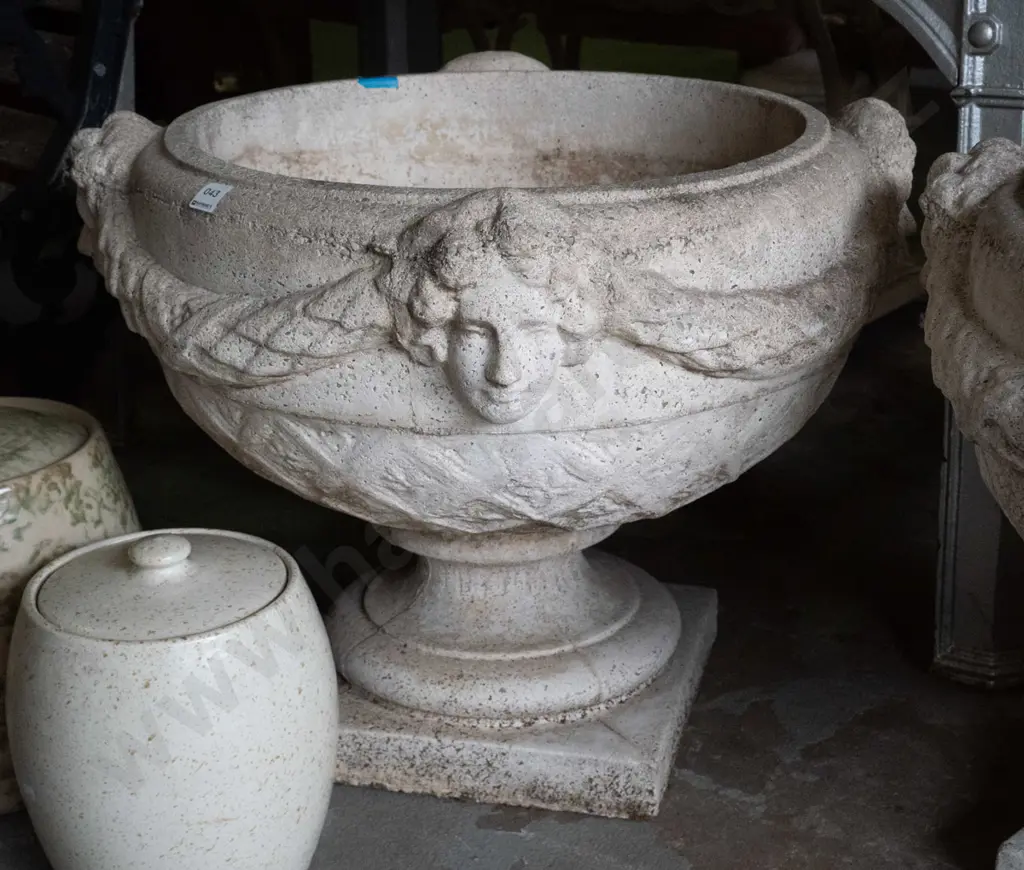 large cast concrete classical style garden urn w/ intertwined swags and female heads, pedestal base on square foot Image 1++