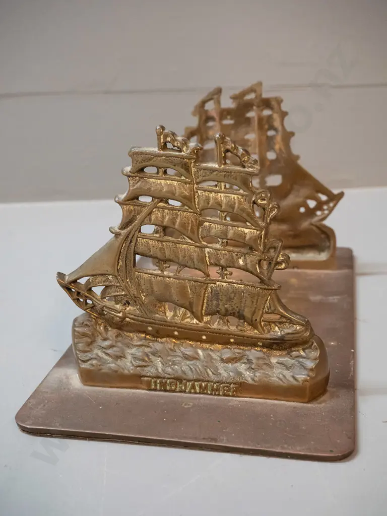 cast brass book stand with fixed ends, sailing ship motif with "Windjammer" on each end. H-130 L-250 D-150 Image 1++