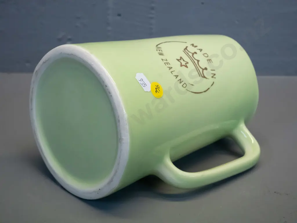 Crown Lynn green glaze milk jug with Crown Lynn logo on side, marked Made in New Zealand on base H-190 W-165 Image 1++