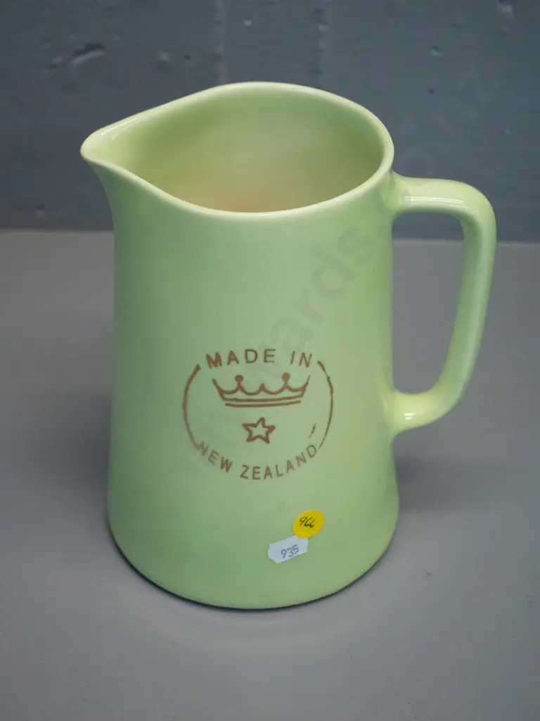 Crown Lynn green glaze milk jug with Crown Lynn logo on side, marked Made in New Zealand on base H-190 W-165 Image 1++