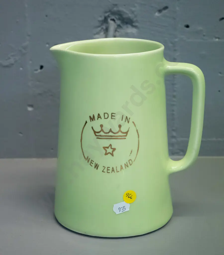 Crown Lynn green glaze milk jug with Crown Lynn logo on side, marked Made in New Zealand on base H-190 W-165 Image 1++