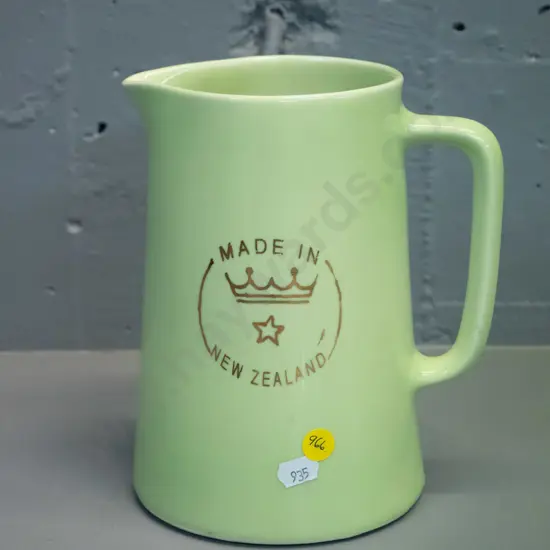Crown Lynn green glaze milk jug with Crown Lynn logo on side, marked Made in New Zealand on base H-190 W-165