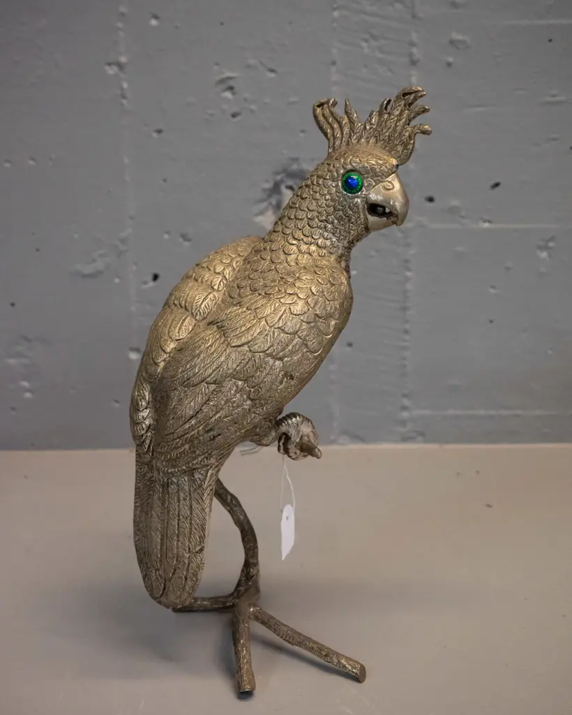brass finish metal figure of a cockatoo with blue-green glass eyes perched on branch H-270 Image 1++