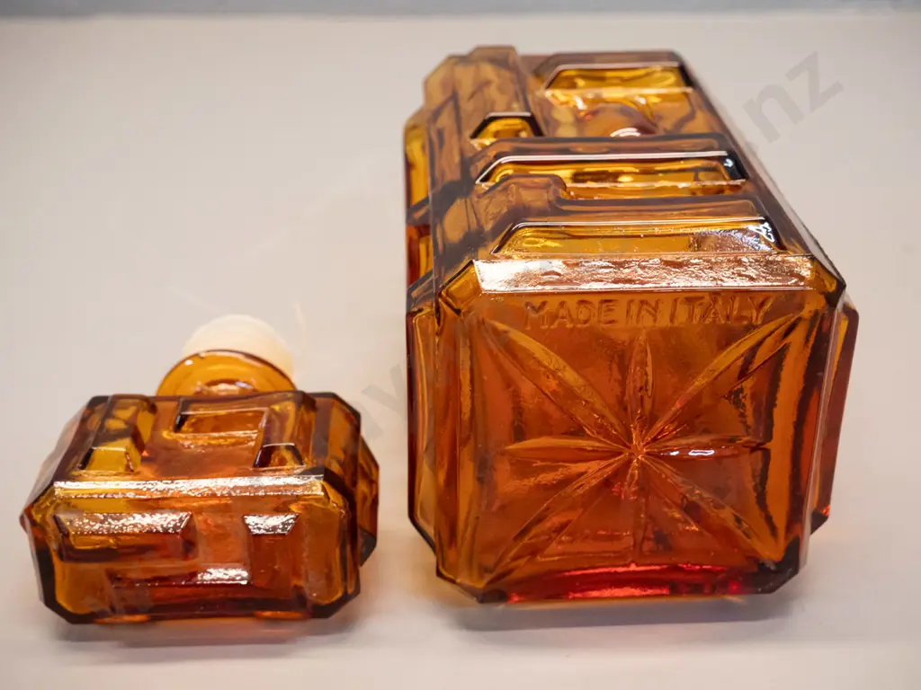 retro Empoli Italy moulded amber glass geometric block pattern stoppered decanter. Minor damage to plastic Image 1++