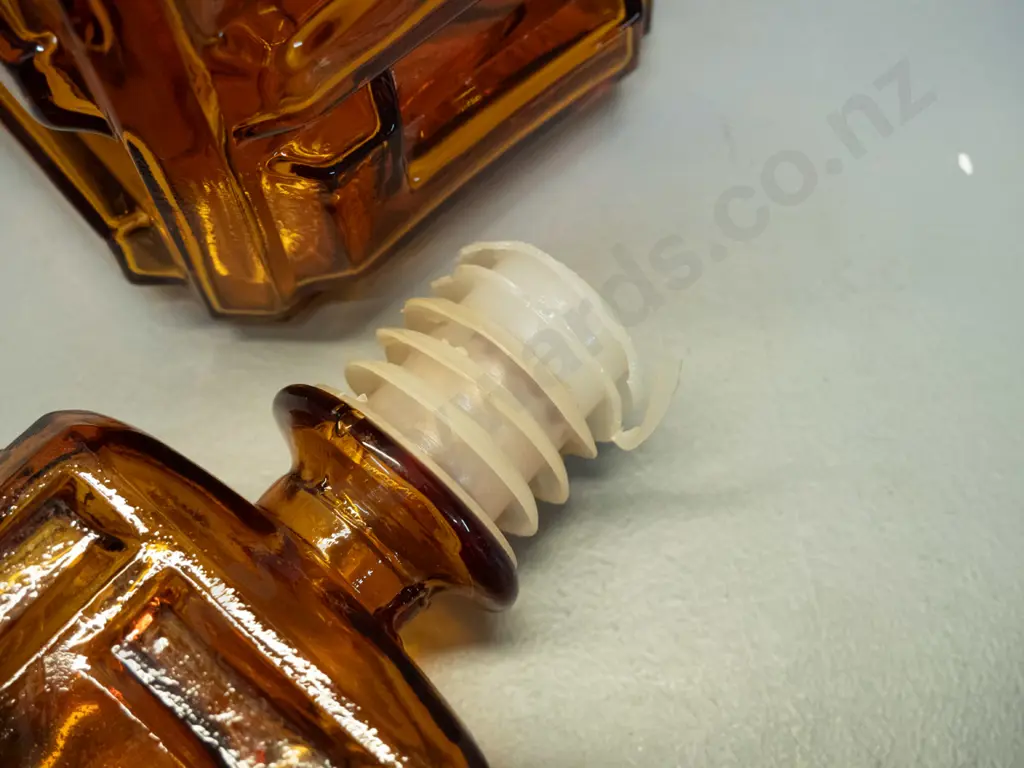 retro Empoli Italy moulded amber glass geometric block pattern stoppered decanter. Minor damage to plastic Image 1++
