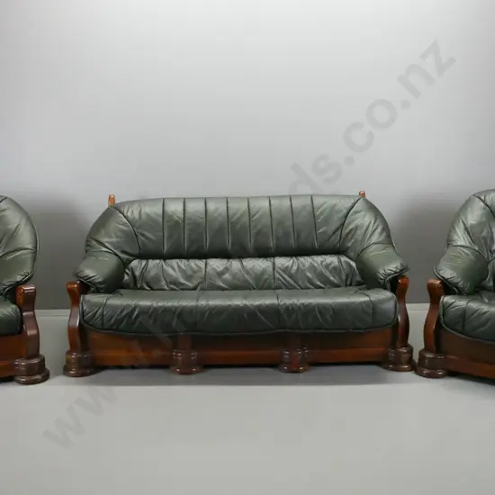 heavy oak-framed green leather upholstered 3-piece lounge suite with shaped fronts, scrolling legs, round front feet,