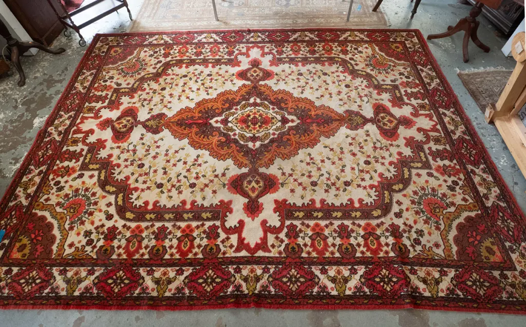 large Feltex New Zealand wool floor rug w/large central medallion, oranges, reds, brown and cream - some wear and stains Image 1++