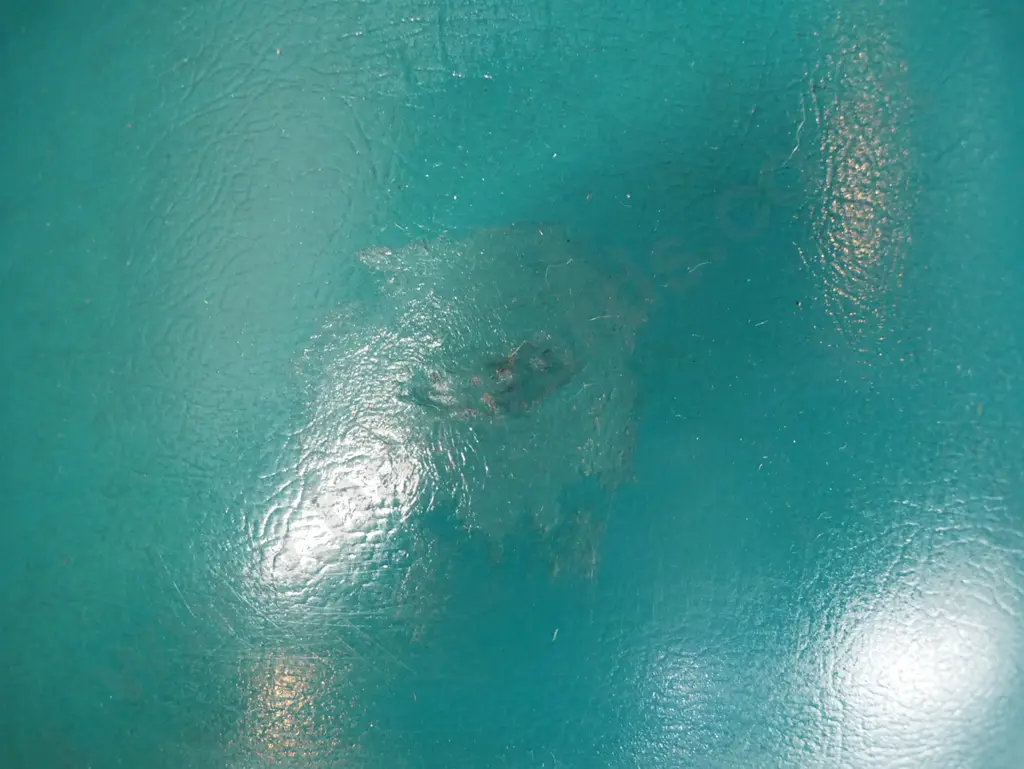 vintage armchair with teal vinyl upholstery, tube-shaped arms, piped edging, ball feet on small casters - repair to top Image 1++