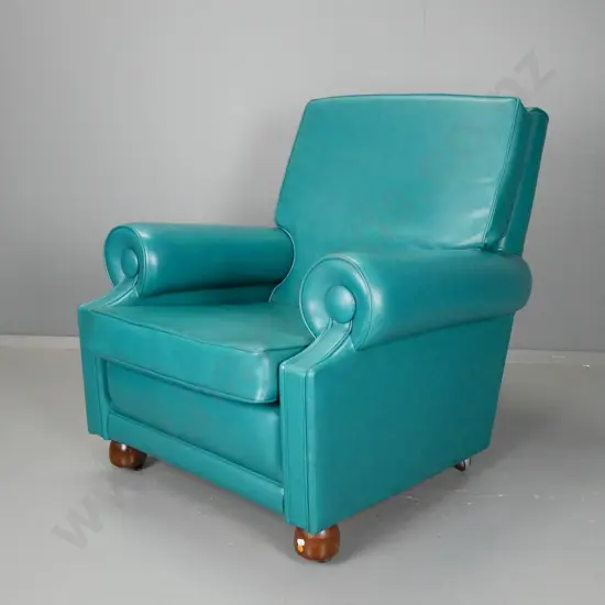 vintage armchair with teal vinyl upholstery, tube-shaped arms, piped edging, ball feet on small casters - repair to top