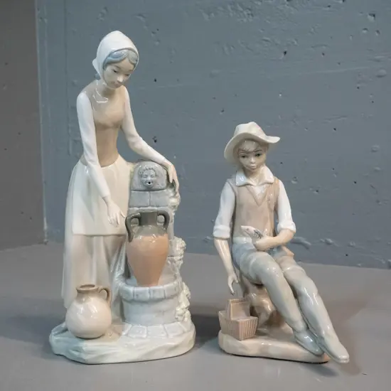 2 figurines - Nao woman at well H-290 and (Cascade? Casa De...?) fishing boy