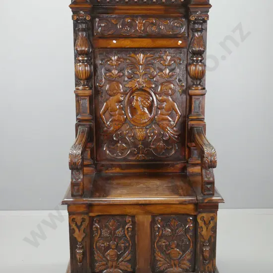 Antique northern European profusely carved oak tall hall seat with lift up storage seat, shaped cornice, carved panels,