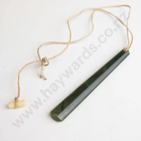 greenstone pendant on rope