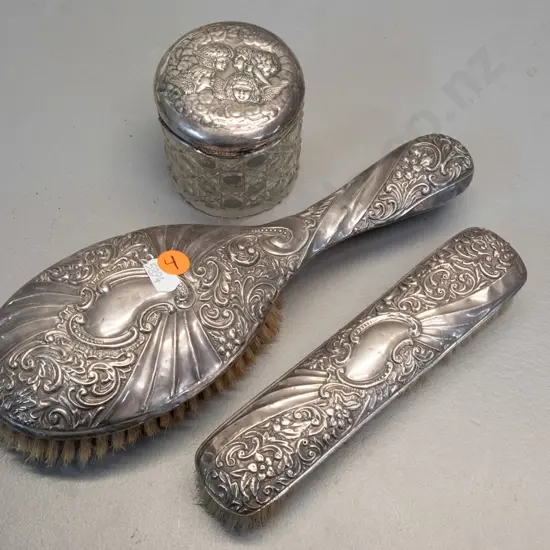 3 pieces of sterling silver dressing table ware - matching hair & clothes brushes and an angel motif sterling lid on a