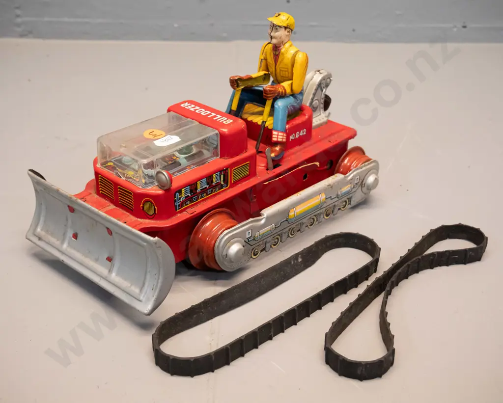 restorer's vintage battery powered tin toy bulldozer with articulated driver, plastic engine cover - rubber tracks have Image 1++