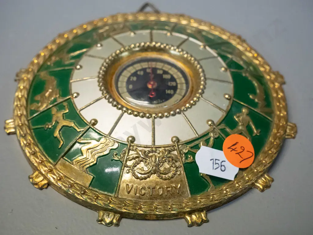 retro small brass coloured cast metal wall thermometer with Olympic sporting motifs - marked "Three Star". D-125 Image 1++