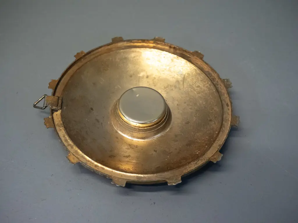 retro small brass coloured cast metal wall thermometer with Olympic sporting motifs - marked "Three Star". D-125 Image 1++