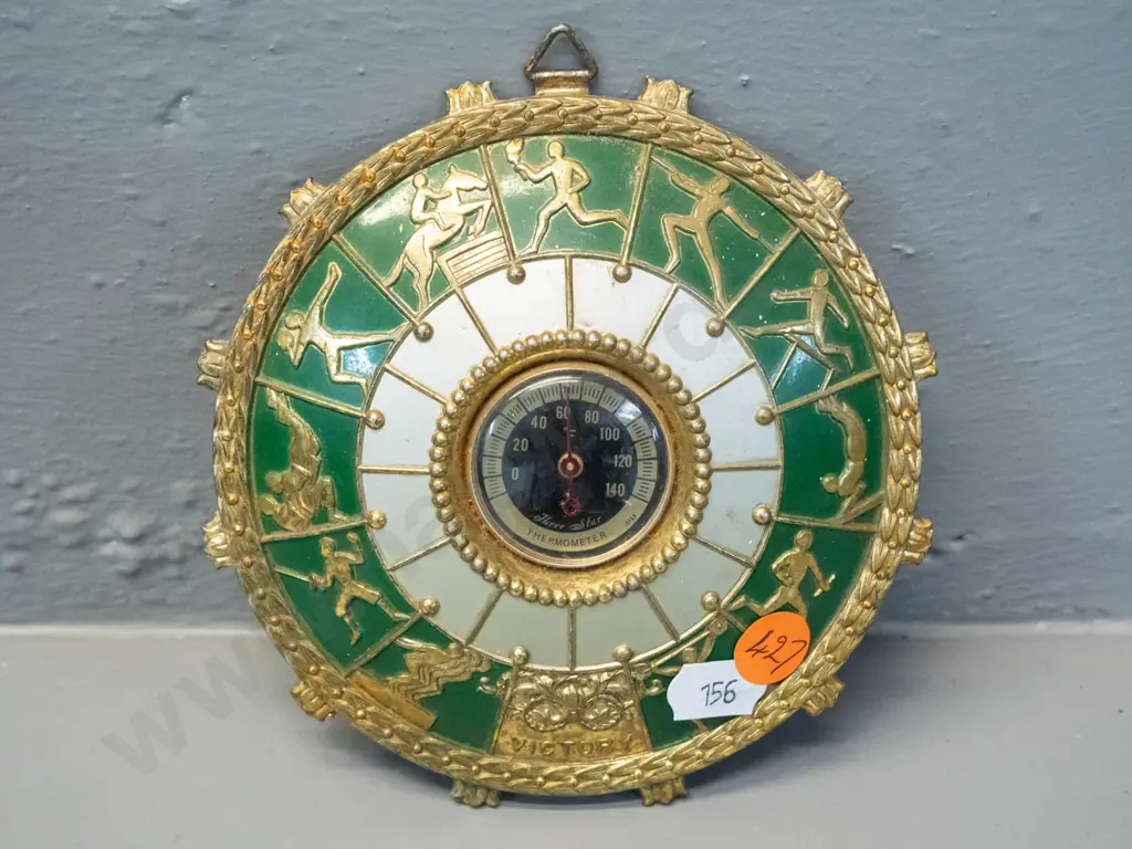 retro small brass coloured cast metal wall thermometer with Olympic sporting motifs - marked "Three Star". D-125 Image 1++