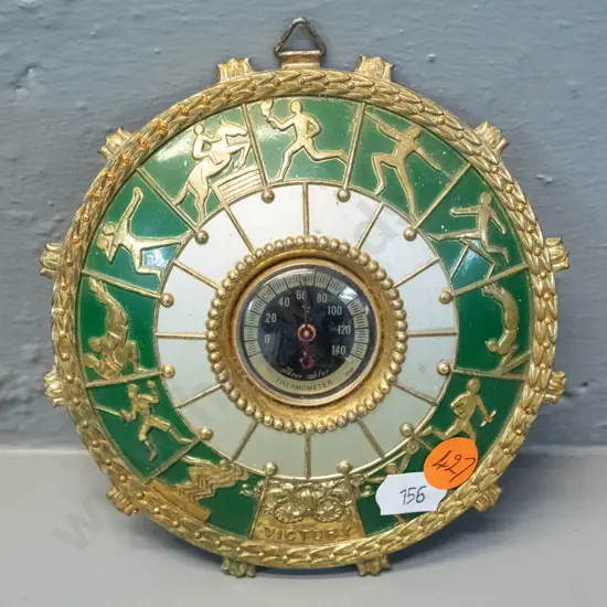 retro small brass coloured cast metal wall thermometer with Olympic sporting motifs - marked "Three Star". D-125