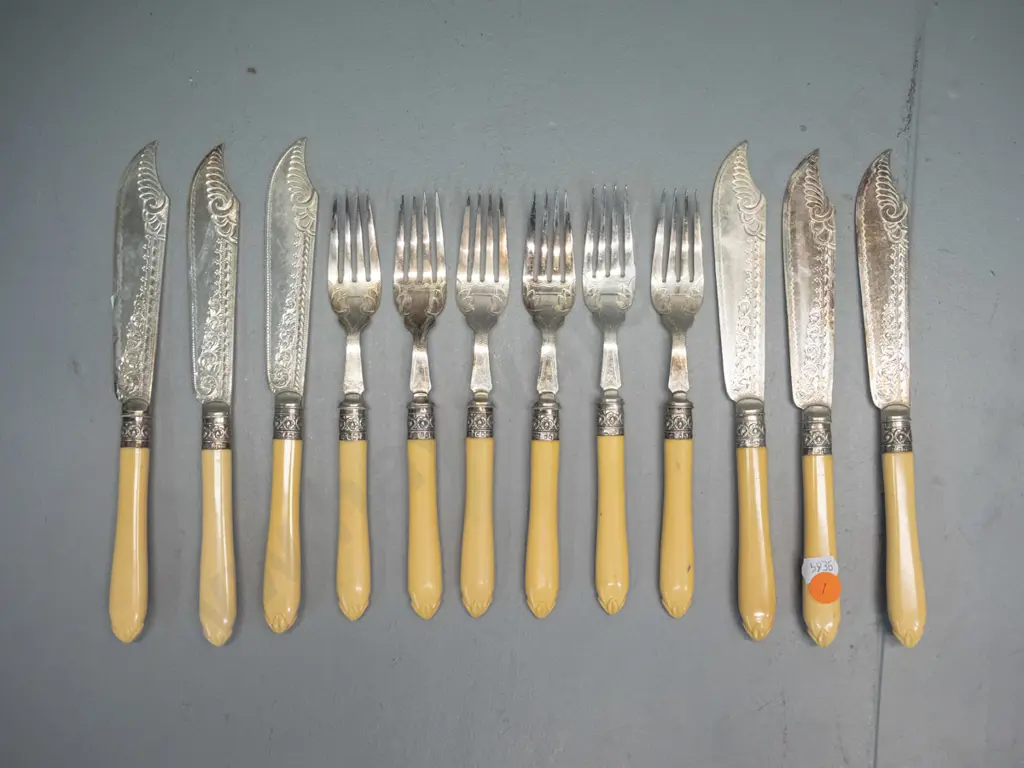 set of 6 faux ivory handled engraved plated fish knives and forks with sterling silver bands Image 1++