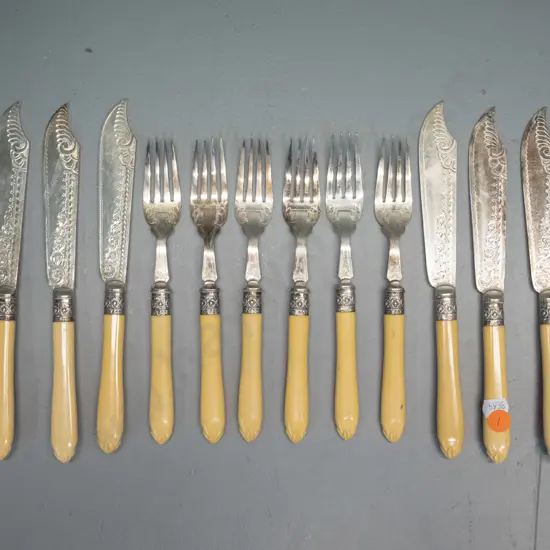 set of 6 faux ivory handled engraved plated fish knives and forks with sterling silver bands