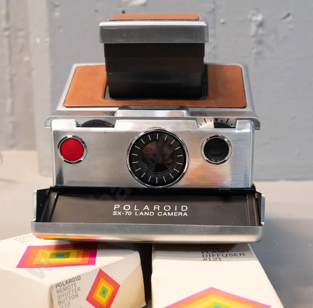Polaroid SX-70 folding instant camera with boxed cable release and flash attachments - camera opening mechanism a little Image 1++