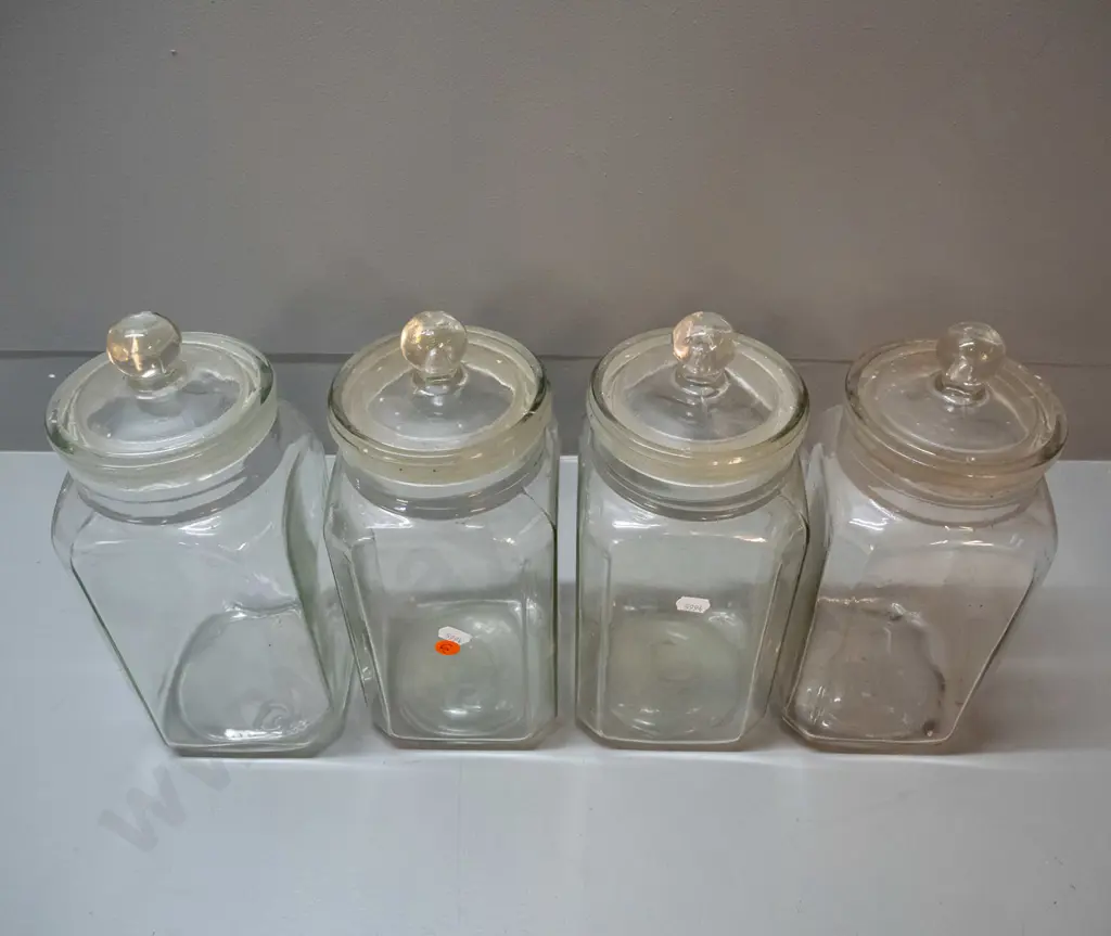4 vintage glass stoppered confectionary / kitchen storage jars - 3 have lids stuck in place, other lid has chips around Image 1++