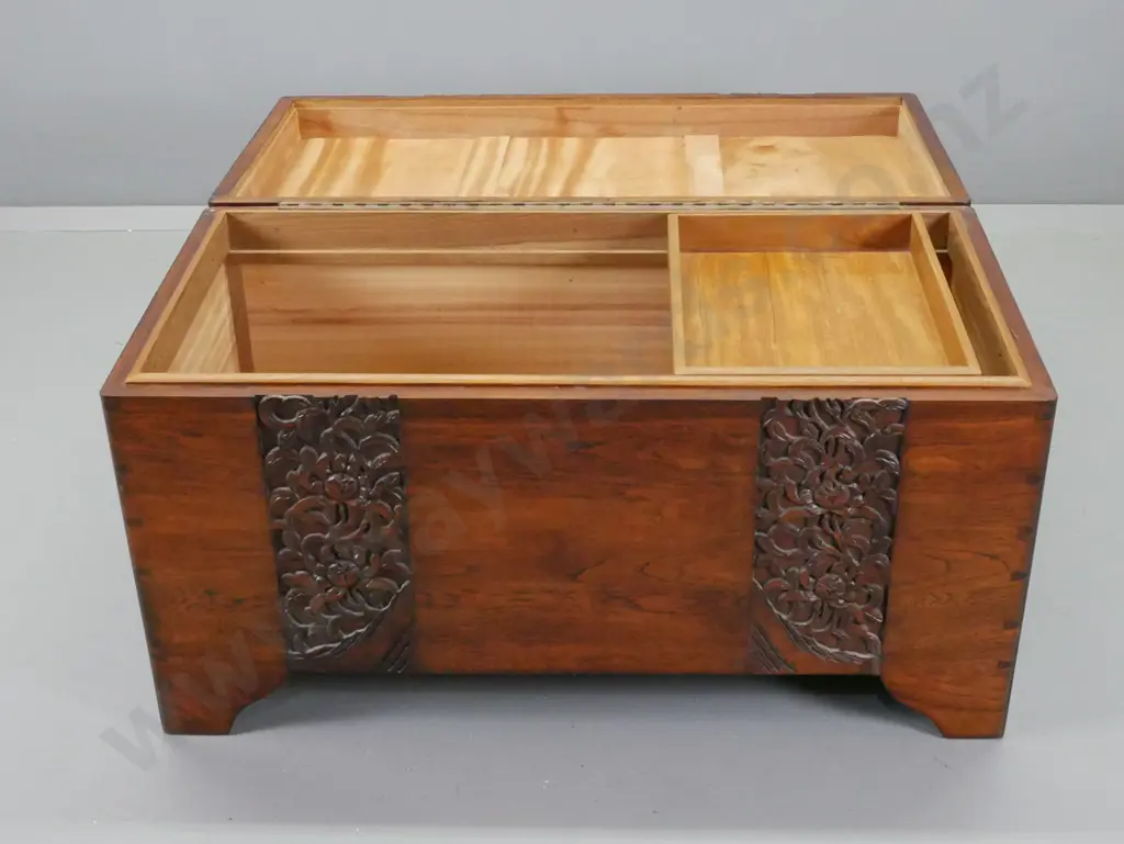 vintage hardwood timber with foliate carved top and front, on shaped feet, cut out carry handles, camphorwood lined with Image 1++
