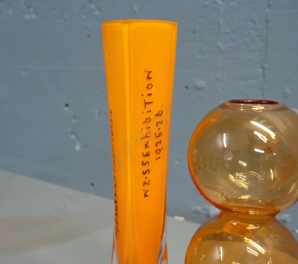 2 glass items - clear based orange 1925-26 South Seas Exhibition souvenir H-200, a thin bubble shape vase Image 1++