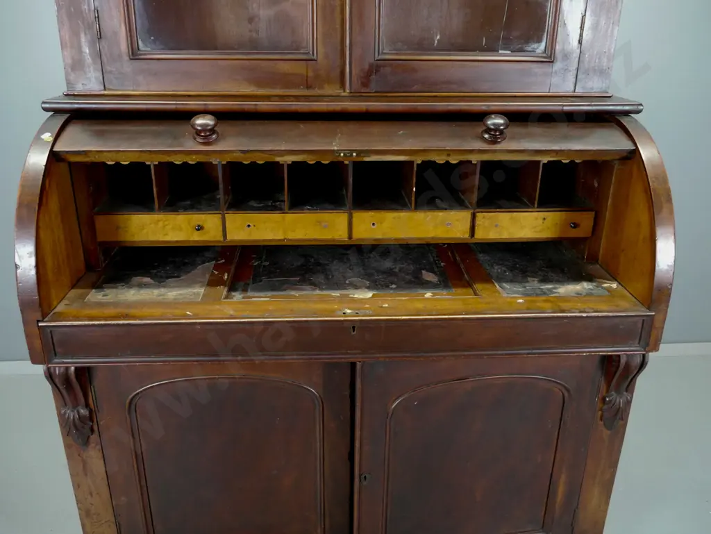 Victorian mahogany barrel top desk with fitted interior and 2 door glazed bookcase on top Image 1++