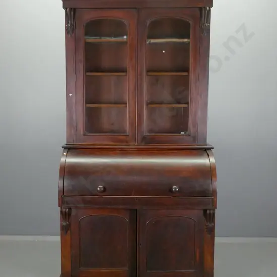 Victorian mahogany barrel top desk with fitted interior and 2 door glazed bookcase on top