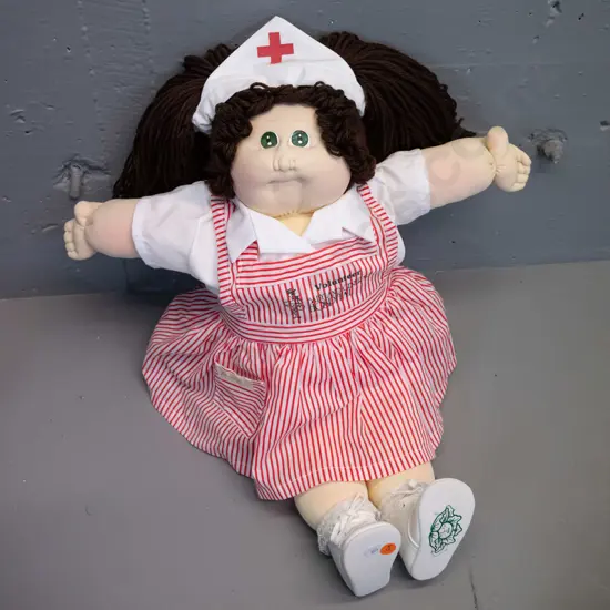 1980s Cabbage Patch kids doll with apron marked "Volunteer - Baby & General Hospital" H540