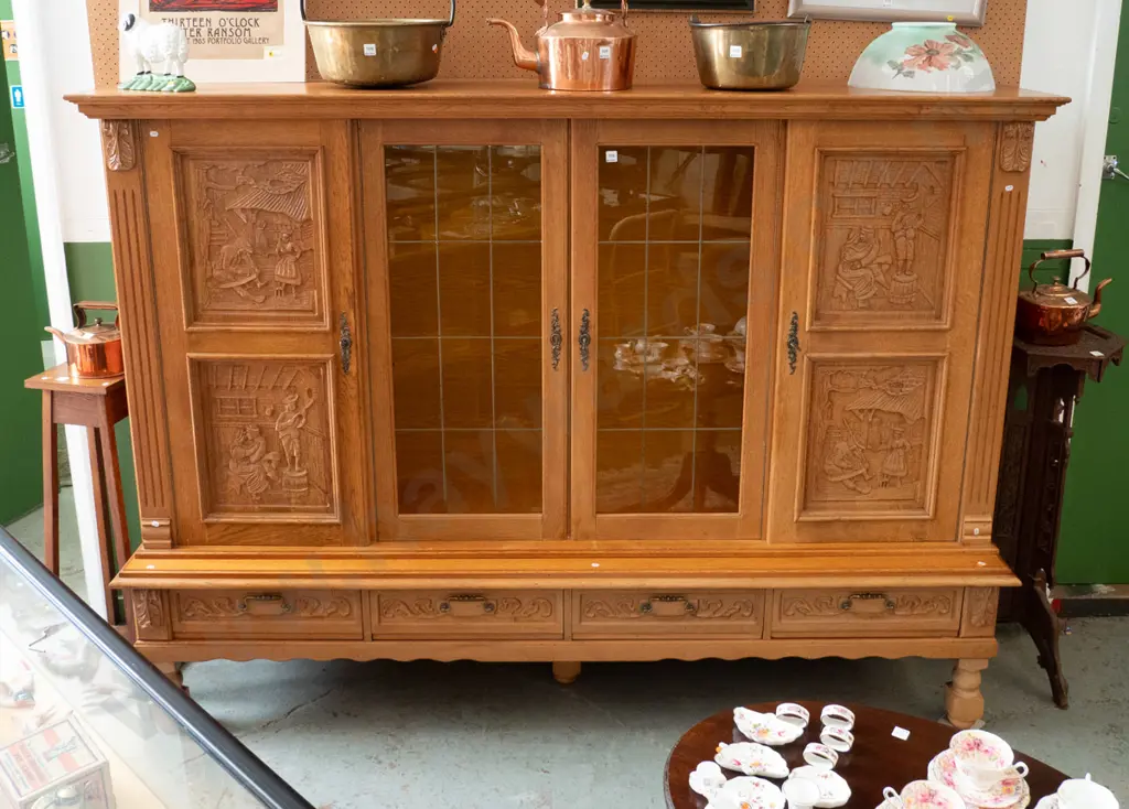 large northern European oak 4-drawer display cupboard 2 leadlight centre doors, 4 carved door panels w/village scenes, Image 1++