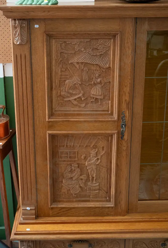 large northern European oak 4-drawer display cupboard 2 leadlight centre doors, 4 carved door panels w/village scenes, Image 1++