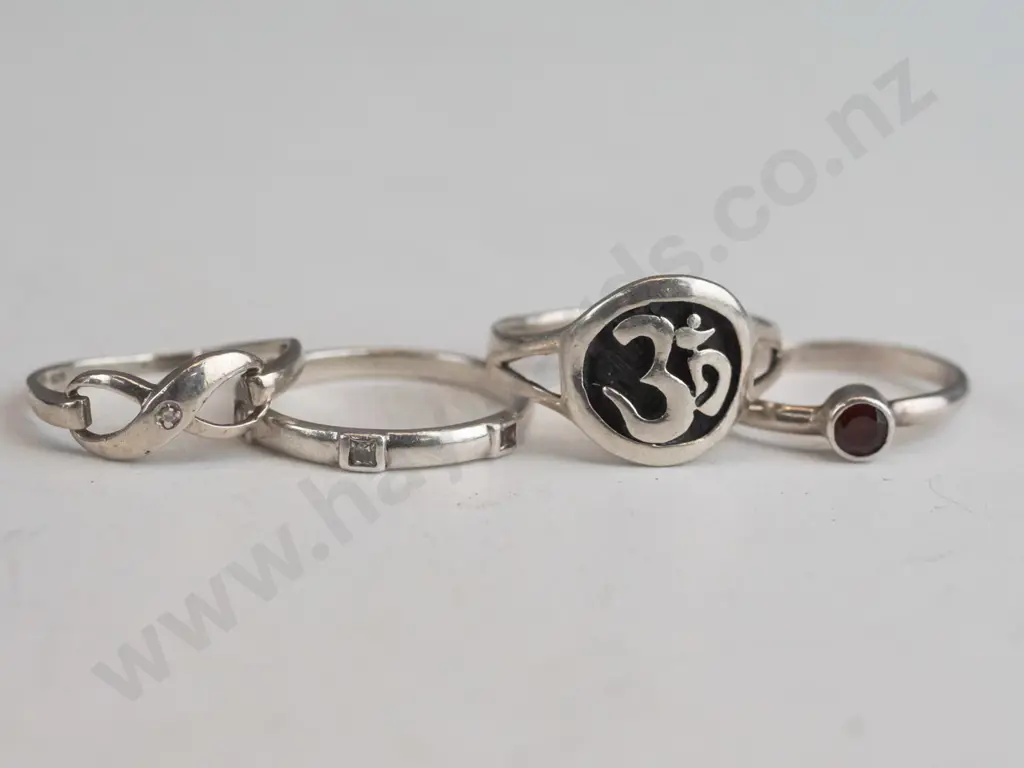 4 asstd silver rings stamped 925 Image 1++