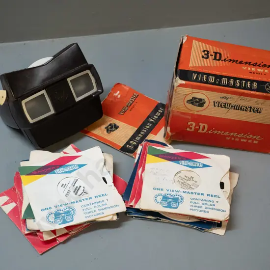 retro Viewmaster with numerous reels and box - Wizard of Oz, Buckaroo Banzai, Sesame Street, Winnie the Pooh, etc.