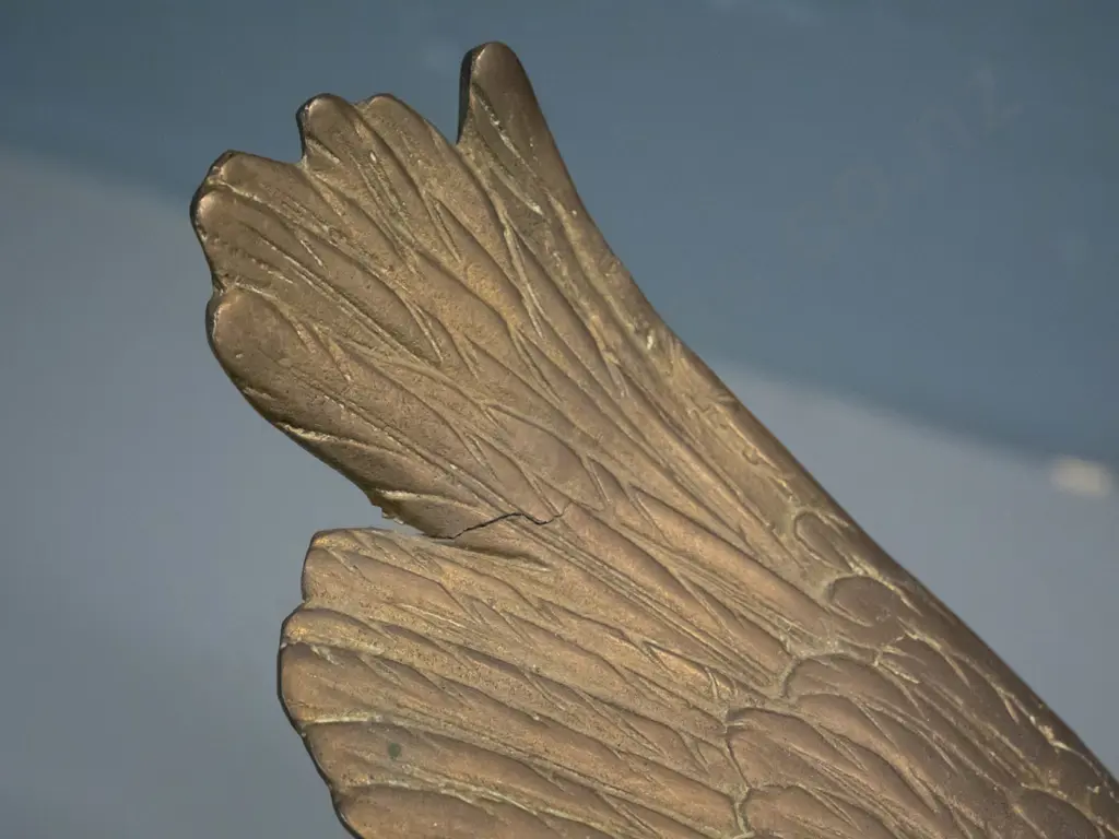 cast brass figure of an eagle with wings spread, standing on rocks - crack to one wing H-285 W-390 Image 1++