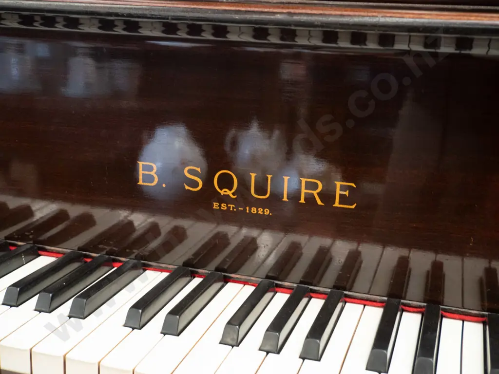 B. Squire 4 ft. baby grand piano on casters, in good condition, some wear to varnish on top, needs tuning Image 1++