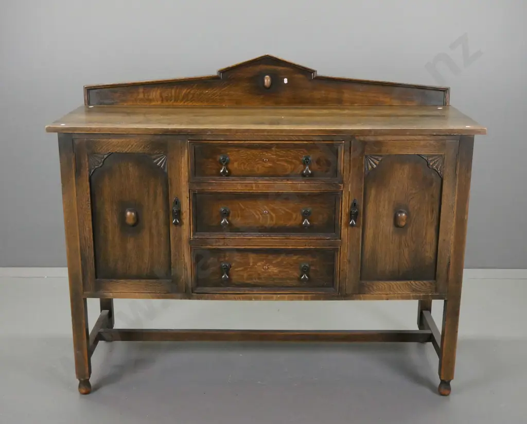 vintage oak Jacobean style sideboard with shaped upstand, 3 central drawer, 2 panelled doors w/fan-shaped corner Image 1++