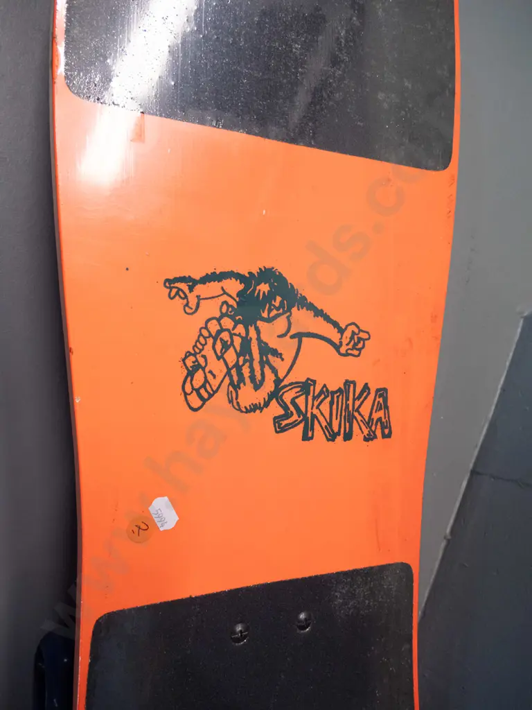 circa 1990s skateboard - Chuck McTruck and "Skika" graphics, still has plastic wrap, wheels stiff L-765 W-260 Image 1++