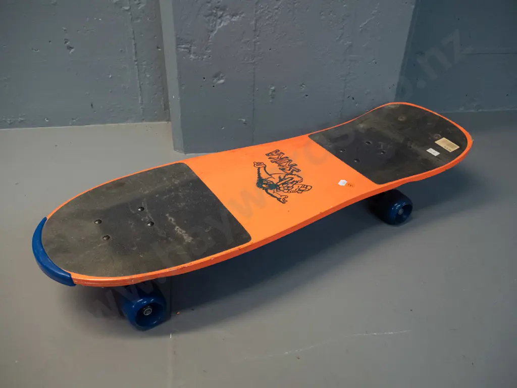 circa 1990s skateboard - Chuck McTruck and "Skika" graphics, still has plastic wrap, wheels stiff L-765 W-260 Image 1++