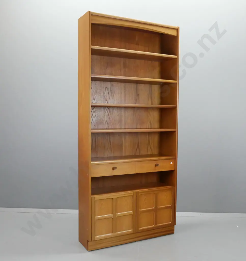 mid-century Parker Knoll teak bookcase with 1 fixed and 3 adjustable shelves, 1 drawer, 2 panelled cupboard doors, Image 1++