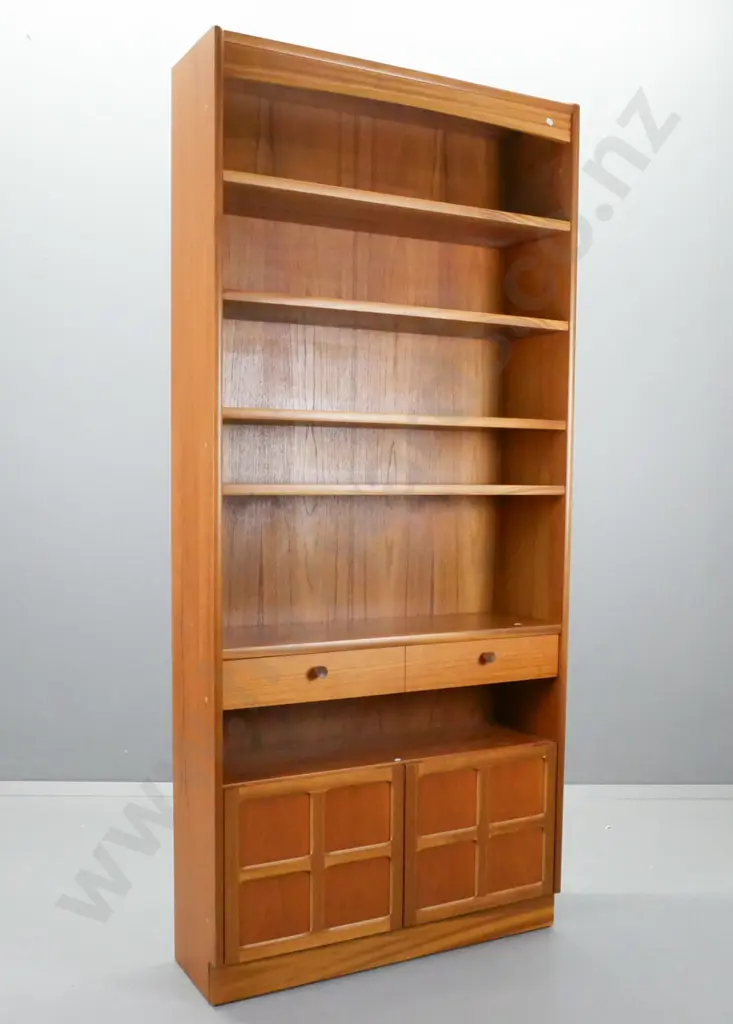mid-century Parker Knoll teak bookcase with 1 fixed and 3 adjustable shelves, 1 drawer, 2 panelled cupboard doors, Image 1++