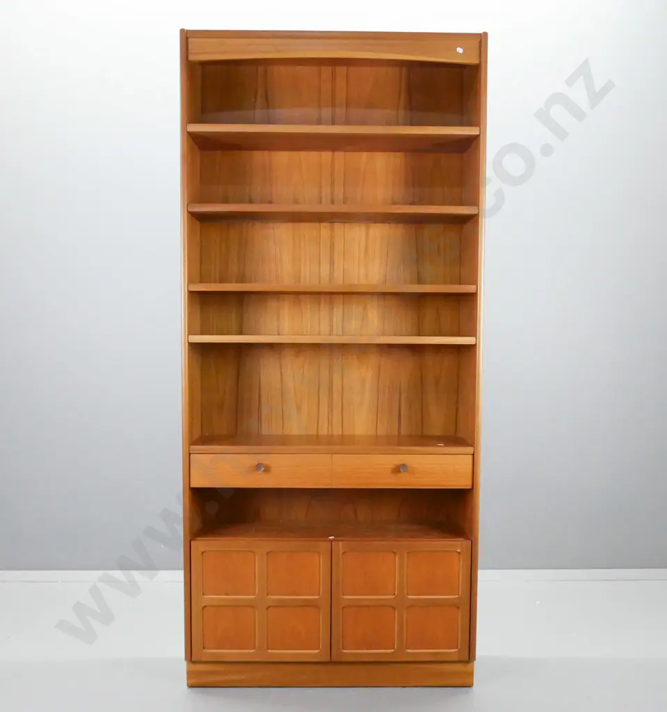 mid-century Parker Knoll teak bookcase with 1 fixed and 3 adjustable shelves, 1 drawer, 2 panelled cupboard doors, Image 1++