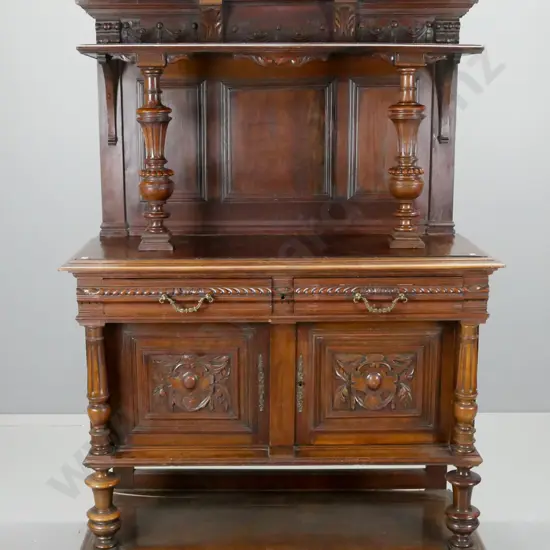 Antique northern European profusely carved walnut sideboard with 2 drawers above 2 carved doors, bottom shelf, upper