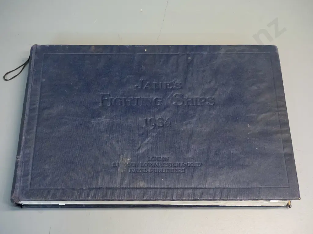 Jane's Fighting Ships register, 1934 edition - rippling and separation to boards, some staining, overall age wear Image 1++